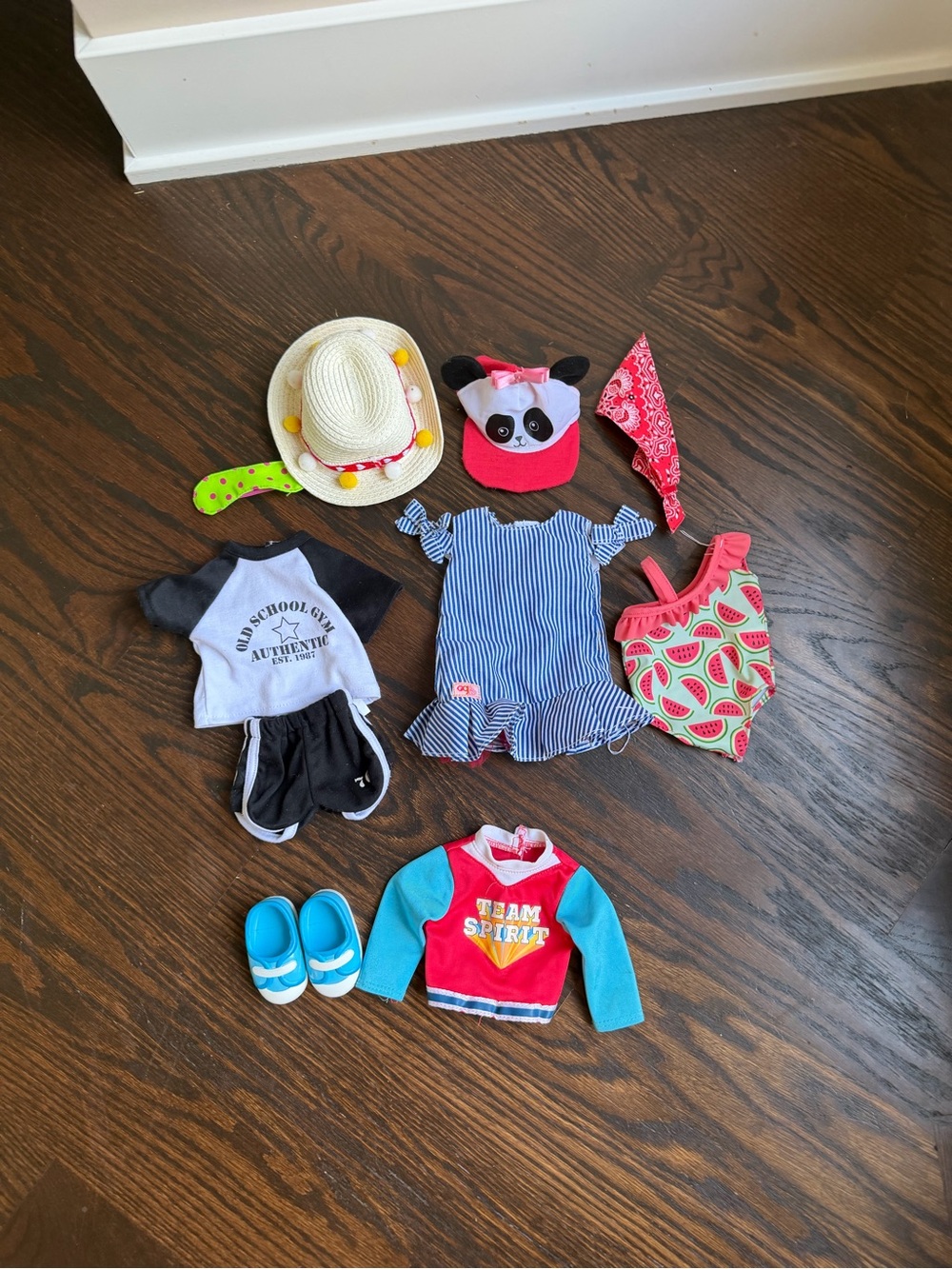 Assortment of 18-inch doll clothing and accessories